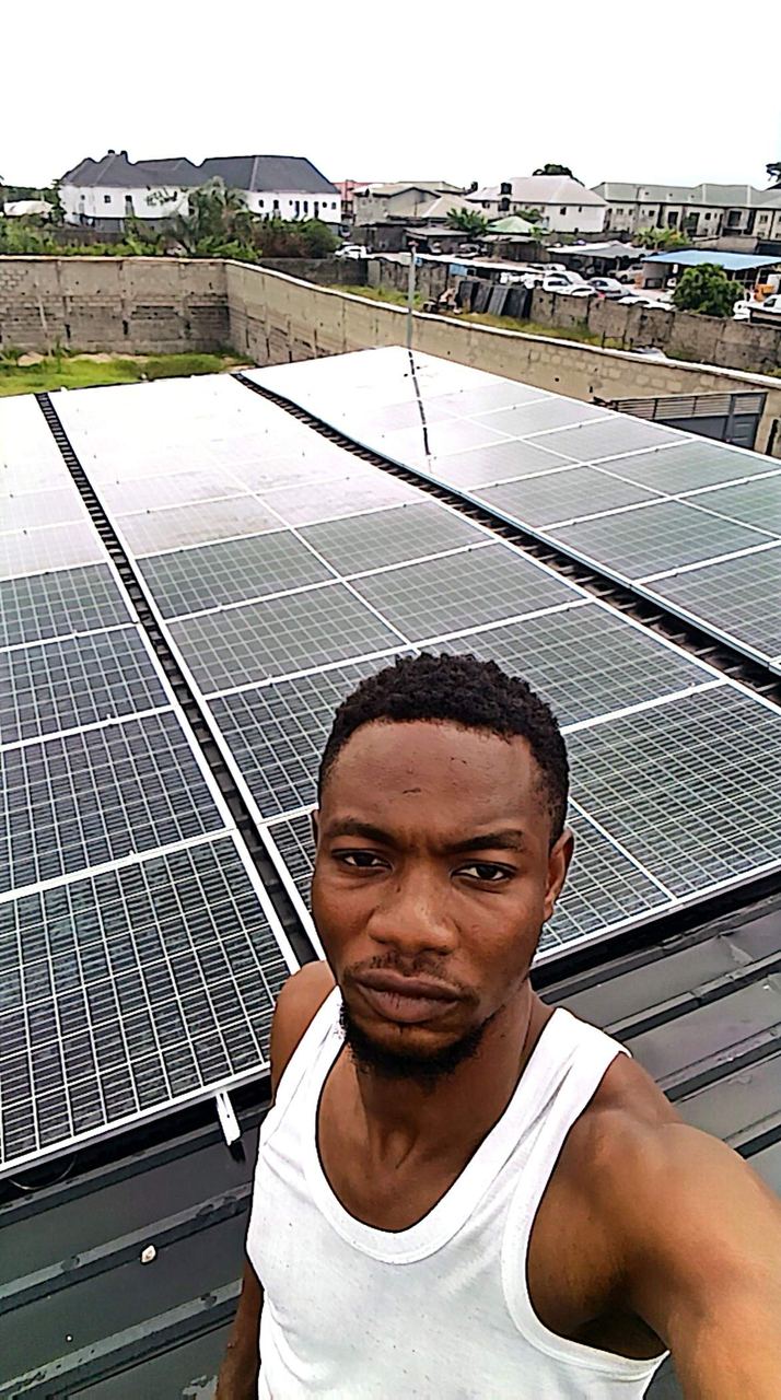 Team member on a completed solar rooftop